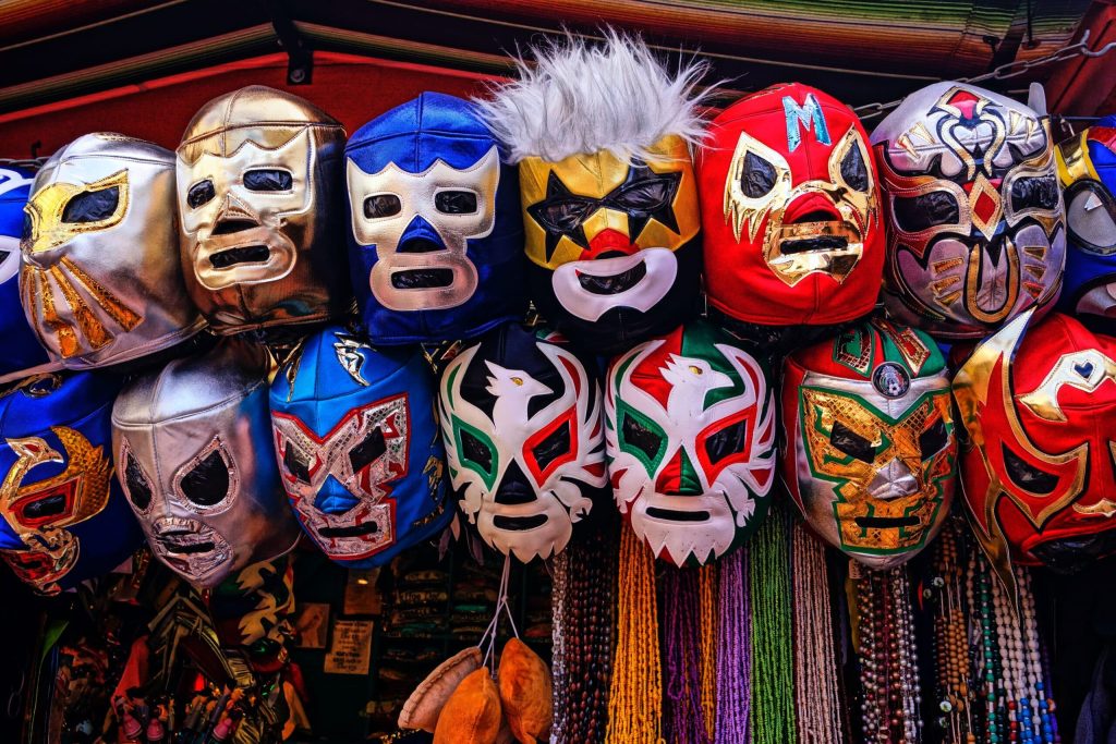 shelf covered in mexica lucha libre masks